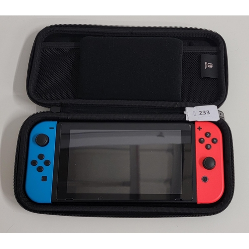 233 - NINTENDO SWITCH 
in a protective case with eight games including Animal Crossing, Skyrim and Just Da... 