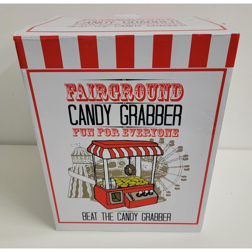 255 - FAIRGROUND CANDY GRABBER 
in box