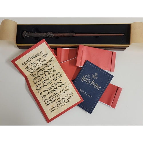 300 - HARRY POTTER BOXED 'HARRY POTTER' WAND
together with The Making of Harry Potter passport, and a numb... 