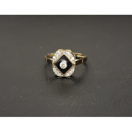 65 - ART DECO STYLE ENAMEL AND DIAMOND RING 
the central bezel set diamond approximately 0.07cts in a bla... 