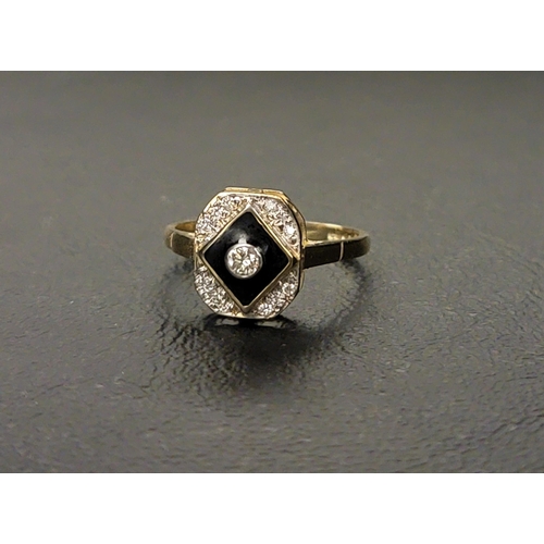 65 - ART DECO STYLE ENAMEL AND DIAMOND RING 
the central bezel set diamond approximately 0.07cts in a bla... 