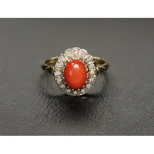 87 - CORAL AND DIAMOND CLUSTER RING 
the central oval cabochon coral section surrounded by diamonds, on a... 