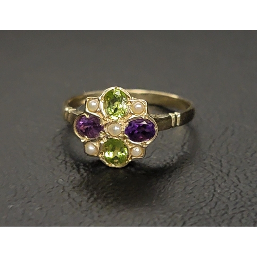 109 - PRETTY 'SUFFRAGETTE' CLUSTER RING
the five seed pearls interspersed with two horizontally set oval c... 