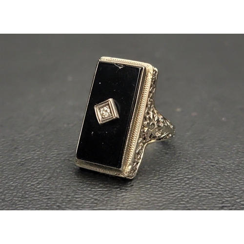 30 - ART DECO BLACK AGATE AND DIAMOND DRESS RING
the rectangular agate panel with central diamond, in fou... 