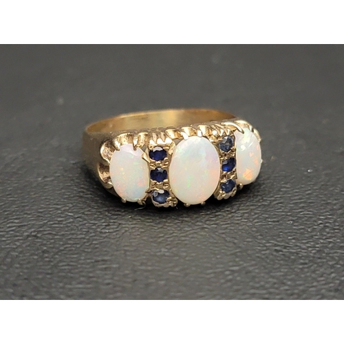 70 - GRADUATED OPAL AMD SAPPHIRE DRESS RING
the three oval cabochon opals separated by small sapphires se... 