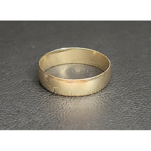 78 - UMMARKED GOLD BAND 
with engraved inscription to interior, ring size X and approximately 2.9 grams