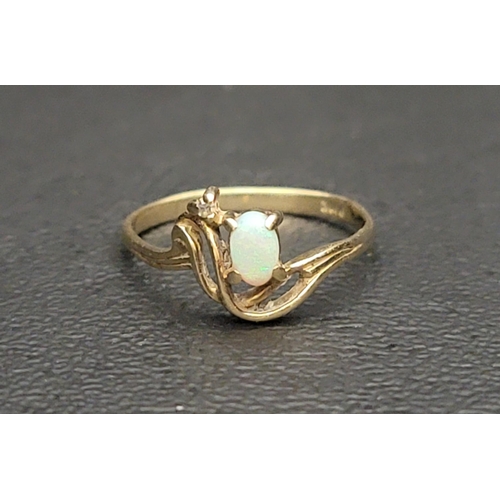 79 - PRETTY OPAL AND DIAMOND RING
the oval cabochon opal and small diamond in scrolling Art Nouveau style... 