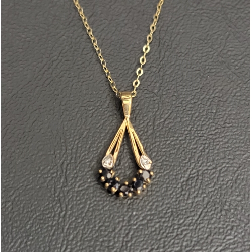 102 - SAPPHIRE AND DIAMOND PENDANT
in nine carat gold and on nine carat gold chain, the pendant approximat... 