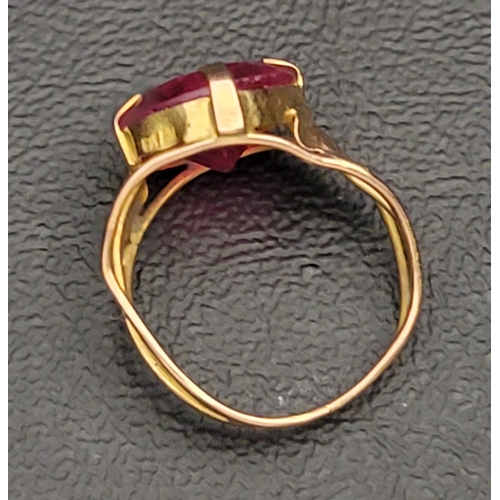 106 - RUBY SINGLE STONE DRESS RING
the circular gemstone approximately 5cts, on gold shank with indistinct... 