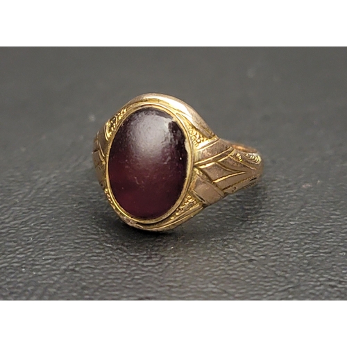127 - NINE CARAT GOLD GLASS SET SIGNET RING
set with oval cabochon purple glass, ring size O-P
