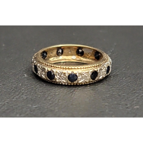 129 - FOURTEEN CARAT GOLD DIAMOND AND SAPPHIRE BAND
the alternating diamonds and sapphires on a raised pla... 