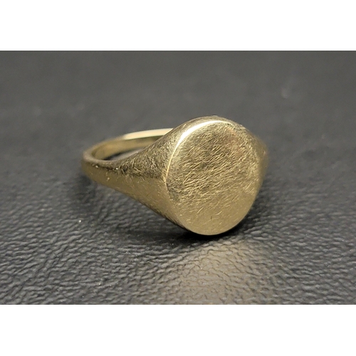 135 - NINE CARAT GOLD SIGNET RING 
with a honey-comb design reverse, ring size P-Q and approximately 2.6 g... 