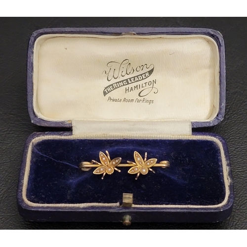 15 - UNMARKED GOLD BROOCH
set with two seed pearl decorated bees, 3cm long and 1.9 grams