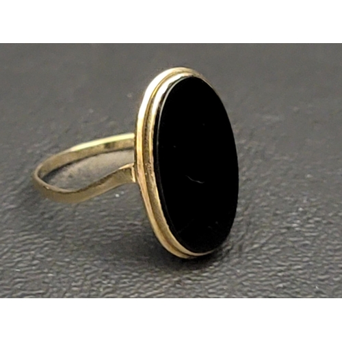 25 - BLACK AGATE SET DRESS RING
in unmarked gold, damage to shank
