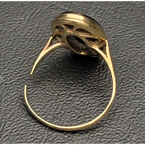 25 - BLACK AGATE SET DRESS RING
in unmarked gold, damage to shank