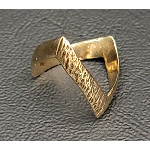 115 - 1970s DOUBLE WISHBONE NINE CARAT GOLD RING
with textured finish to one side, approximately 2.2 grams