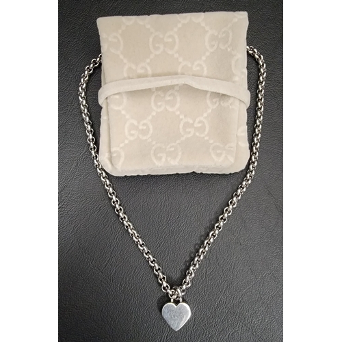 122 - GUCCI TRADEMARK SILVER HEART PENDANT
NECKLACE
the pendant on heavy belcher link necklace, total weig... 