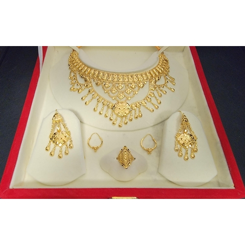 139 - UNMARKED HIGH CARAT GOLD SUITE OF INDIAN WEDDING JEWLLERY
comprising two sets of earrings, a ring an... 