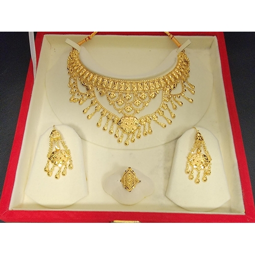 139 - UNMARKED HIGH CARAT GOLD SUITE OF INDIAN WEDDING JEWLLERY
comprising two sets of earrings, a ring an... 