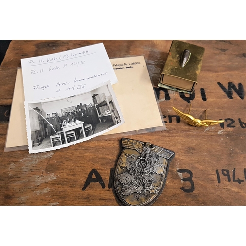 395 - SELECTION OF MILITARY ITEMS
including a brass RAF eagle cap badge, German 1941 1942 Krim (Crimea) ba... 