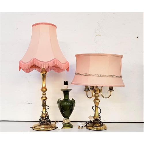 494 - BRASS THREE BRANCH LAMP
raised on a circular base with a circular pale pink shade, 55cm high, a bras... 