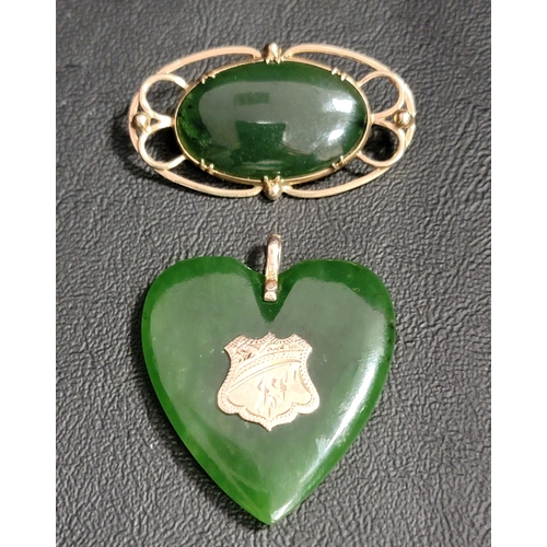 114 - JADE HEART SHAPED PENDANT
with central nine carat gold panel and suspension loop, approximately 4cm ... 