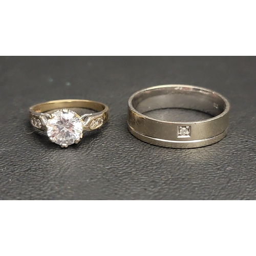 158 - TWO NINE CARAT GOLD RINGS 
comprising a diamond set band with a line engraving and a CZ solitaire ri... 