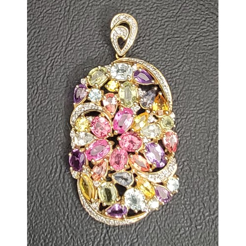 35 - MULTI GEM SET PENDANT
the pierced oval pendant set with colourful gemstones including diamond, pink ... 