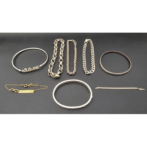 184 - SELECTION OF SILVER BRACELETS 
including bangles, chains and an engraved identity bracelet