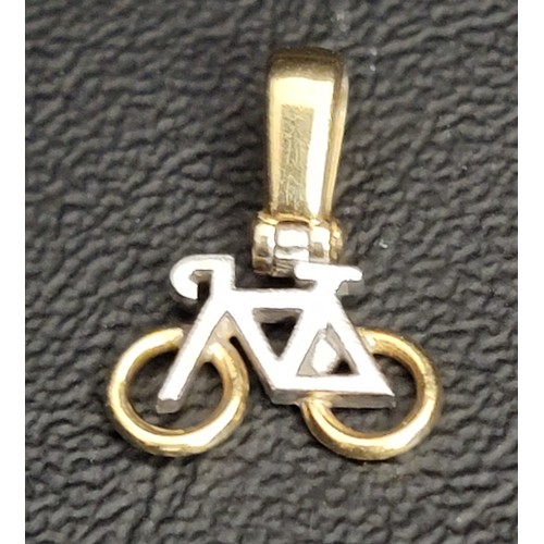 185 - EIGHTEEN CARAT GOLD BIKE PENDANT
with white gold making up the body of the bike and yellow gold acce... 