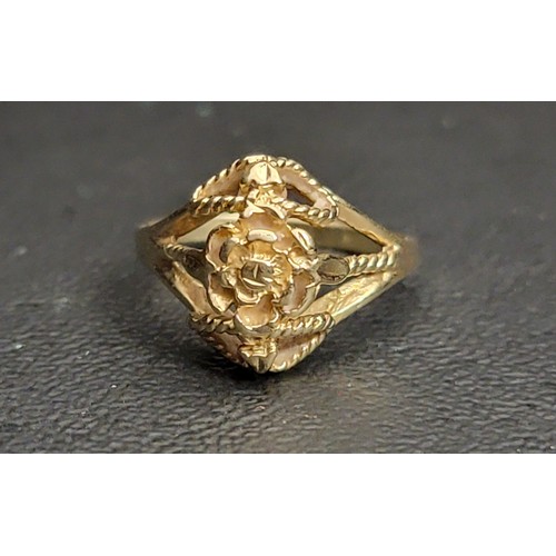 199 - INTRICATE TEN CARAT GOLD RING 
with a pierced floral design decorated with twisted strands, approxim... 