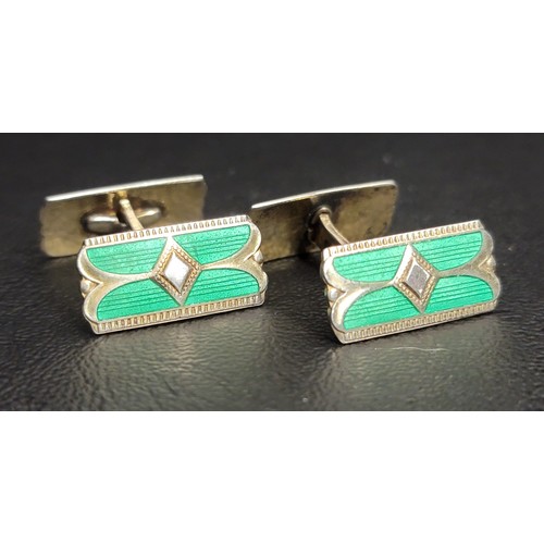 203 - ART DECO ENAMEL DECORATED SILVER AND GOLD-PLATED CUFFLINKS
the vibrant green enamel situated within ... 