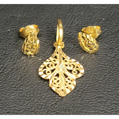 204 - DELICATE TWENTY-ONE CARAT GOLD PENDANT AND EARRINGS
of intricate pierced design with foliage motifs,... 