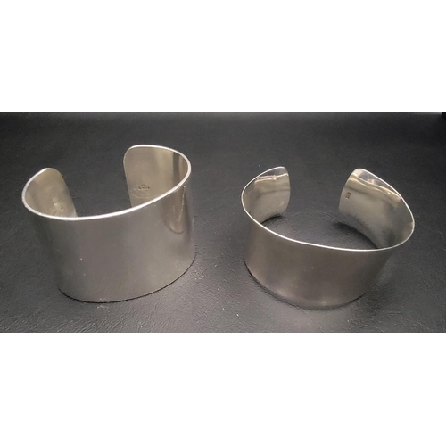 206 - TWO HEAVY SILVER CUFF BRACELETS 
total weight approximately 133.4 grams