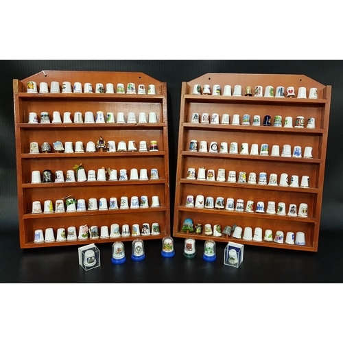 323 - LARGE COLLECTION OF PORCELAIN THIMBLES
on two display boards and some loose examples, with some in m... 