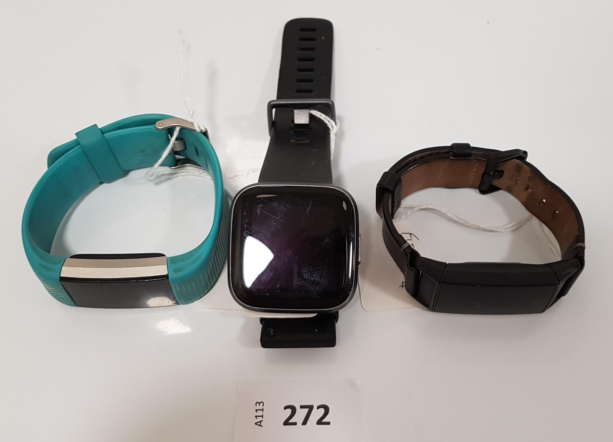 THREE FITBIT FITNESS TRACKERS comprising Versa 2 Charge 4 and