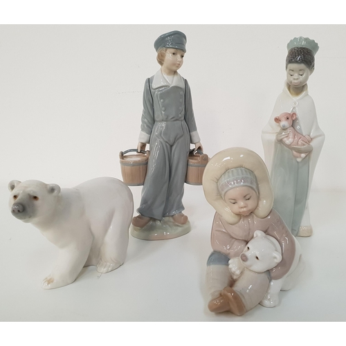 229 - FOUR LLADRO FIGURINES
Eskimo playing with a polar bear cub 1195, 12.5cm high, Attentive polar bear 1... 