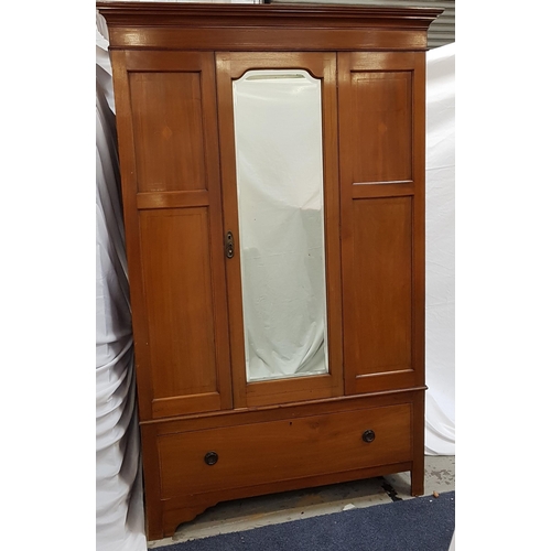 535 - EDWARDIAN MAHOGANY AND INLAID WARDROBE
with a moulded cornice above a central bevelled mirror door f... 