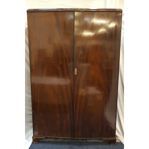 536 - MAHOGANY TWO DOOR WARDROBE
with an internal door mounted mirror, shelf and hanging rail, standing on... 