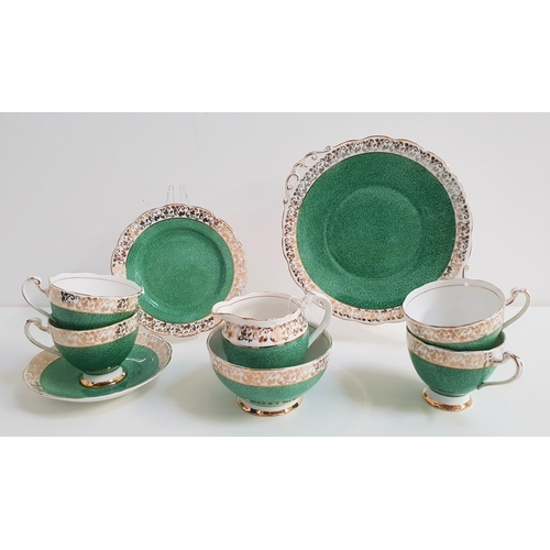 192 - ROSLYN CHINA TEA SET
decorated with a mottled green ground with a gilt border, comprising eleven cup... 