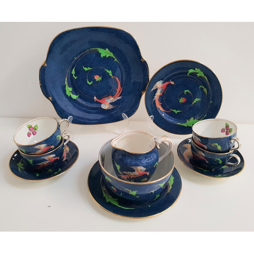 205 - CROWN STAFFORDSHIRE TEA SET
decorated in the Phoenix pattern on a blue ground, comprising ten cups, ... 