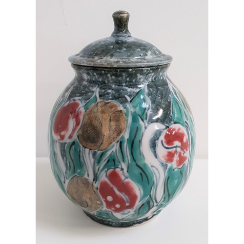 233 - HIGHLAND STONEWARE JAR AND COVER
decorated with tulips, 24cm high