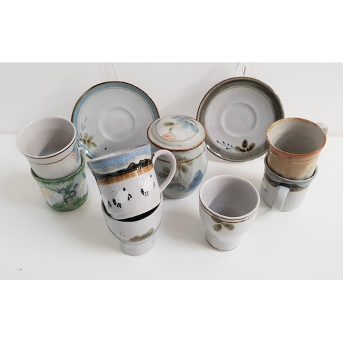 245 - SELECTION OF HIGHLAND STONEWARE
including six beakers, five mugs, four saucers and a lidded sugar ja... 