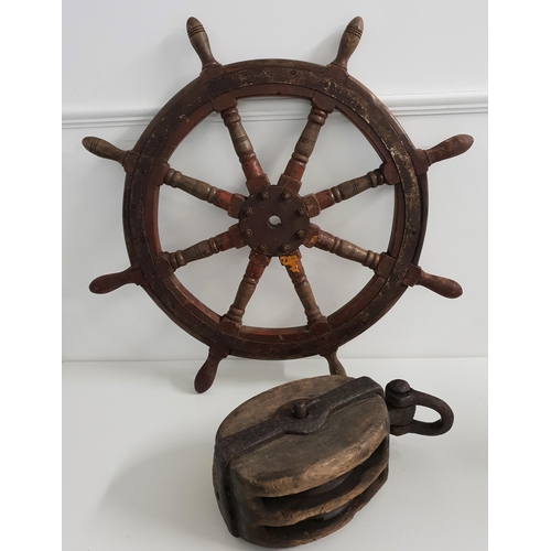 299 - NAUTICAL INTREST
a ships eight spoke wheel with iron banding, 93cm diameter, together with a large e... 