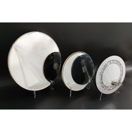 310 - TEN CIRCULAR MIRRORED CANDLE PLATES
with diamante sides, 20cm diameter, 21cm diameter and 30cm diame... 