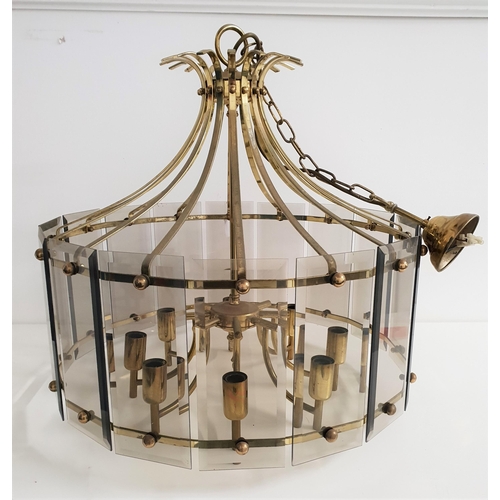 521 - MODERN GILT BRASS CHANDELIER
with smoked glass bevelled panels around eight shaped arms, with suspen... 