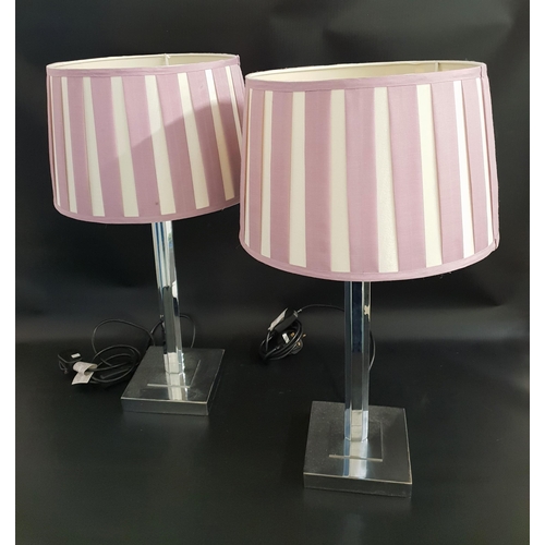 528 - PAIR OF LAMPS
raised on a square chrome base with flattened chrome columns and mauve and cream shade... 