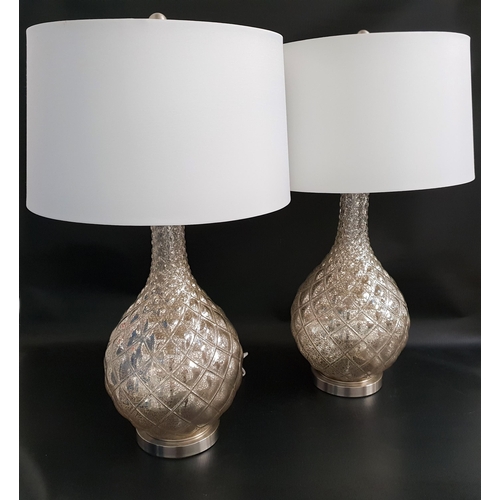 531 - PAIR OF MOTTLED GLASS LAMPS
raised on a circular chrome base with a bulbous tapering body and white ... 