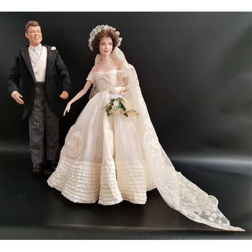 406 - TWO FRANKLIN MINT HEIRLOOM DOLLS
of John F Kennedy as the groom and Jacqueline Kennedy as the bride,... 