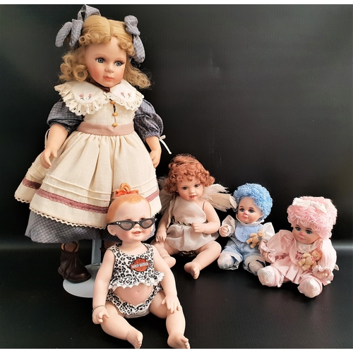 409 - THE FRANKLIN MINT COLLECTOR DOLLS
'Crying Bryna' and 'Winged Cherub', and Harley-Davidson porcelain ... 